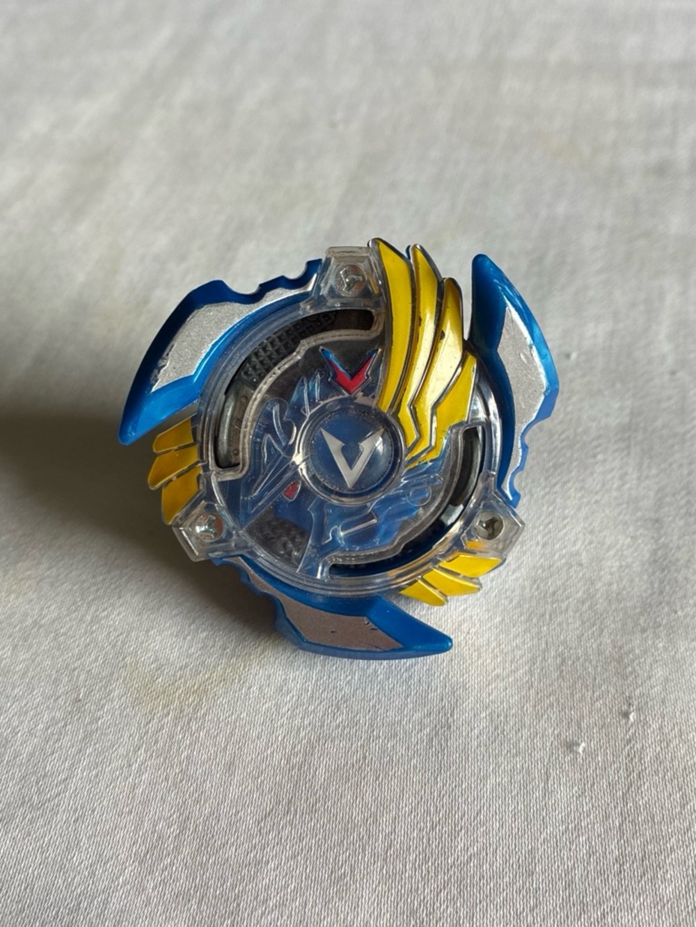 Beyblade Blue & Yellow Spinning Top with Clear Emblem